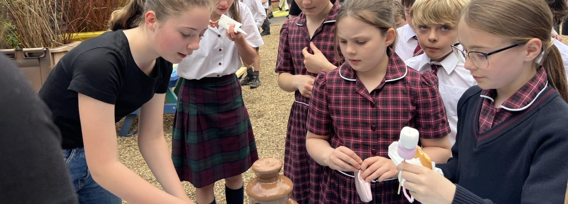students around a chocolate fountain